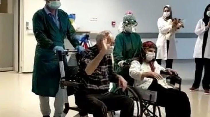 Corona virüsü yenen 82 yaşındaki çift, alkışlarla taburcu oldu