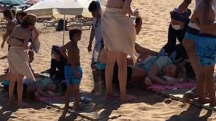 Plajda yürüyen genç kadın aşırı sıcaktan fenalaştı!