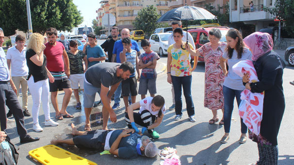 Yaralının başında şemsiye nöbeti tuttular!